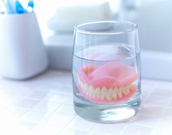 example of caring for dentures in San Antonio. 