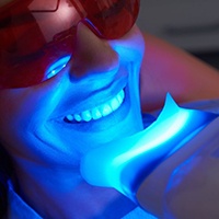 close up of woman getting in-office teeth whitening 