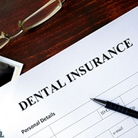 Dental insurance form resting on a table
