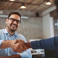 Man shaking hands with a San Antonio emergency dentist