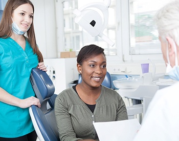 Patient listening to her emergency dentist in San Antonio