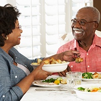 A senior couple eating a healthy meal at home