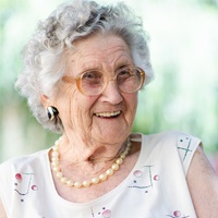 Smiling older woman outdoors