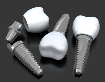 Closeup of single tooth dental implants on a gray background