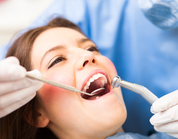 Woman receiving dental exam