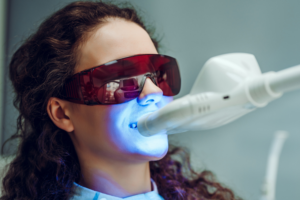 woman at dentist undergoing teeth whitening in Castle Hills