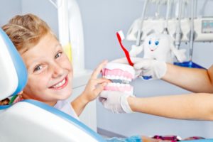 Girl using children’s dental insurance coverage.