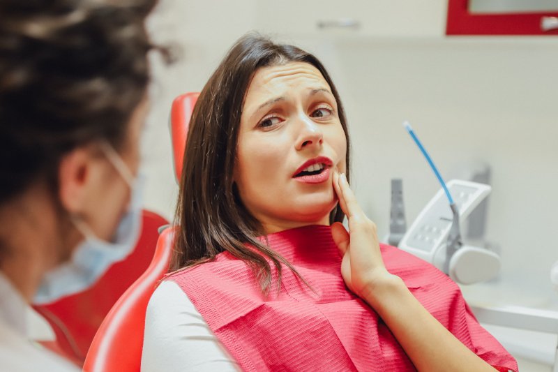 Woman with a loose tooth