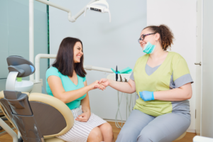 a patient smiling at their dentist